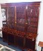 A 19th century and later satinwood banded mahogany breakfront bookcase, 241.5 cm high, approximately 230 cm wide, 42 cm deep                                                                                                