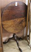 A late George II mahogany circular snap-top table with revolving top, birdcage support on column H.69cm Diam. 72                       