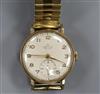 A gentleman's 9ct gold Smiths De Luxe manual wind wrist watch.                                                                         