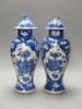 A pair of 19th century Chinese blue and white prunus vases and covers, height 38cm, a Kangxi marks                                                                                                                          