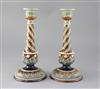 A pair of Doulton Lambeth stoneware candlesticks, height 30cm                                                                          