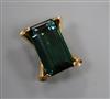 A yellow metal mounted (tests as 14ct) baguette cut green tourmaline clip brooch,                                                      