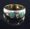 An 18ct gold and gypsy set jade and diamond five stone ring, size X.                                                                   