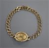 A yellow metal mounted curblink bracelet with engraved oval plaque(a.f.),                                                              