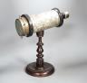 A Victorian kaleidoscope, on original turned wood stand, 39cm                                                                                                                                                               