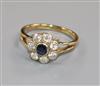 An 18ct gold, sapphire and diamond flower head cluster ring, size N.                                                                   