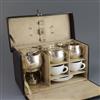 A cased early 20th century German 935 standard silver and porcelain travelling picnic set,                                             