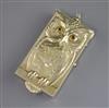 A rare early 20th century sterling silver gilt novelty compact, decorated with an owl on a perch, 11.8cm.                              