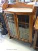 A 1920's leaded glazed bowfront oak bookcase. W-73, D-25, H-108cm.                                                                                                                                                          