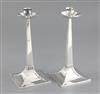 An Edwardian pair of Arts & Crafts silver candlesticks, by James Dixon & Sons, 22cm.                                                   