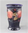 A Moorcroft pomegranate pattern trumpet vase, height 18.5cm                                                                            