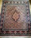 A Persian red ground rug 150 x 123cm                                                                                                   