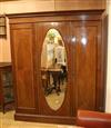 An Edwardian inlaid triple wardrobe W.180cm                                                                                            