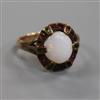 An early 20th century yellow metal, white opal and gem set ring in the "suffragette" colours, size N.                                  