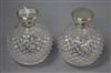A pair of George V engine turned silver topped cut glass globular scent bottles, GW, London, 1920, 12.5cm.                             