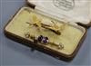 An Edwardian 15ct gold and seed pearl twin swallow brooch and a yellow metal gem set bar brooch.                                       