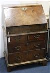 An early 18th century style walnut bureau incorporating older timbers                                                                  