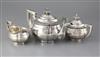 A late 19th/early 20th century Chinese Export silver three piece tea set by Zee Wo, Shanghai, gross 42 oz.                             