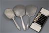 A set of six George V silver bean end coffee spoons, cased and three George V silver dressing table items.                             