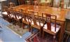 A Chinese hardwood extending dining table, with 2 spare leaves W.275cm                                                                 