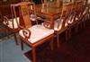 A set of eleven Chinese hardwood dining chairs                                                                                         