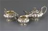 A George IV silver three-piece melon-shaped tea service, London 1827, Rebecca Eames & Edward Barnard I, gross 42.5 oz.                 