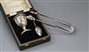 A pair of William IV silver fiddle pattern sugar tongs and a George V silver egg cup and spoon (cased) (3)                             