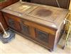 A walnut coffer with three carved panels W.134cm                                                                                       