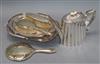 A silver-mounted four-piece dressing table set, a plated fluted teapot and two plated swing-handled baskets                            