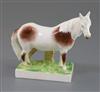 A previously undocumented Rockingham porcelain figure of a skewbald pony, c.1830, L. 15cm                                              