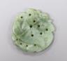 A Chinese carved green hardstone pendant shaped as a fish, 5cm                                                                                                                                                              