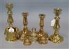 Two pairs of brass candlesticks, four embossed brass table bells of varying sizes and an Art Nouveau brass pot                         