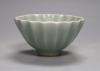 A Chinese celadon fluted cup, 9cm                                                                                                                                                                                           