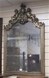 A silvered wood wall mirror with cherub crest H.108cm                                                                                  