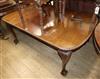 A 1930's Chippendale style carved mahogany extending dining table, on claw and ball feet Extended 160cm                                