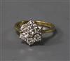 An 18ct gold and diamond cluster ring, size H.                                                                                         