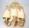 A pair of early 20th century gilt brass girandole mirrors, 39cms high.                                                                                                                                                      