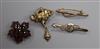 A Victorian garnet set brooch and three other brooches.                                                                                