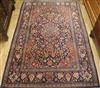 An Isfahan red ground medallion rug 202cm x 133cm                                                                                      