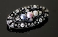 An early 20th century gold and silver, diamond and three colour split pearl set oval openwork brooch,                                  