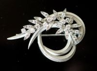 A mid 20th century French 18ct white gold and diamond set foliate scroll clip brooch,                                                  