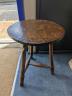 A circular burr elm and ash primitive cricket table with T shaped stretcher, diameter 44cm, height 61cm                                                                                                                     
