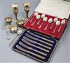 A cased set of eight 1970's silver picture back teaspoons by Mappin & Webb, a cased set of cake knives, silver spill vases etc.        