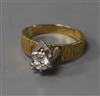 A textured 18ct gold and solitaire diamond ring, size Q.                                                                               