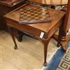 A George II mahogany backgammon table having reversible baize-lined top with counter wells and pull-out W.73cm                         