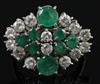 An 18ct white gold, diamond and emerald cluster dress ring, size P/Q.                                                                  