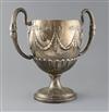 A George III Irish silver two handled pedestal cup, 66.5 oz.                                                                           