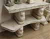 Two reconstituted stone garden benches, on lion supports W.119.5 and 140cm approx                                                      