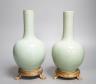 A pair of Chinese celadon crackle glazed bottle vases with gilt metal stands total height 27cm, bases drilled                                                                                                               