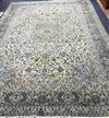 A Persian cream gorund carpet 400 x 300cm                                                                                              